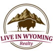 “Live in Wyoming Realty” logo with mountains and a bison inside a circular badge, maroon and brown color scheme on a transparent background.